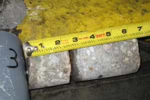tape ruler measuring 2 rocks